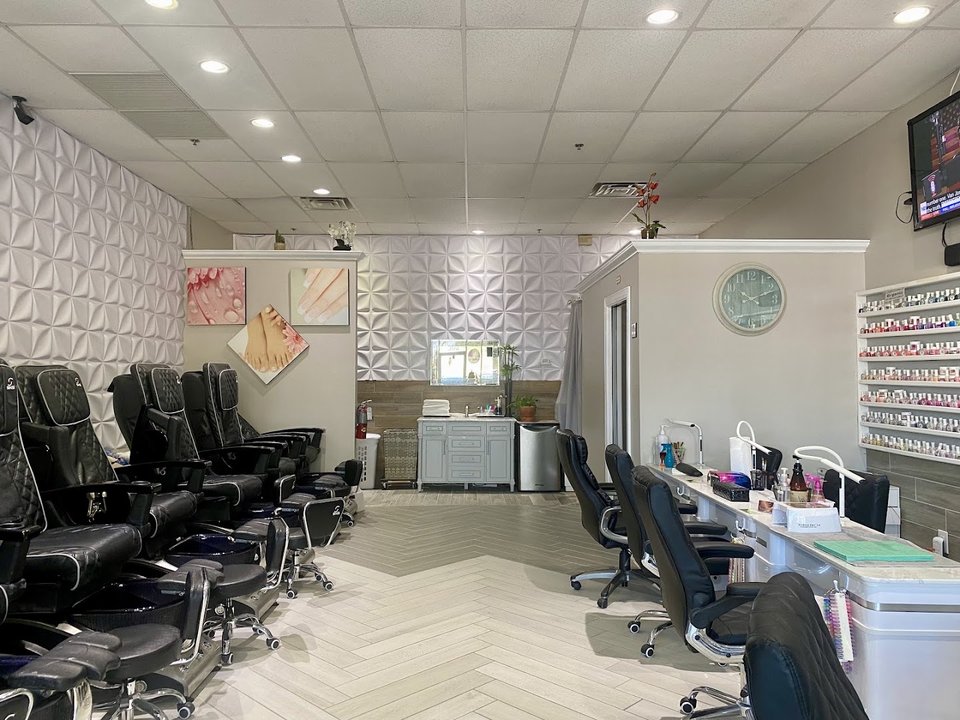 Nail salon station with polish bottles nearby.